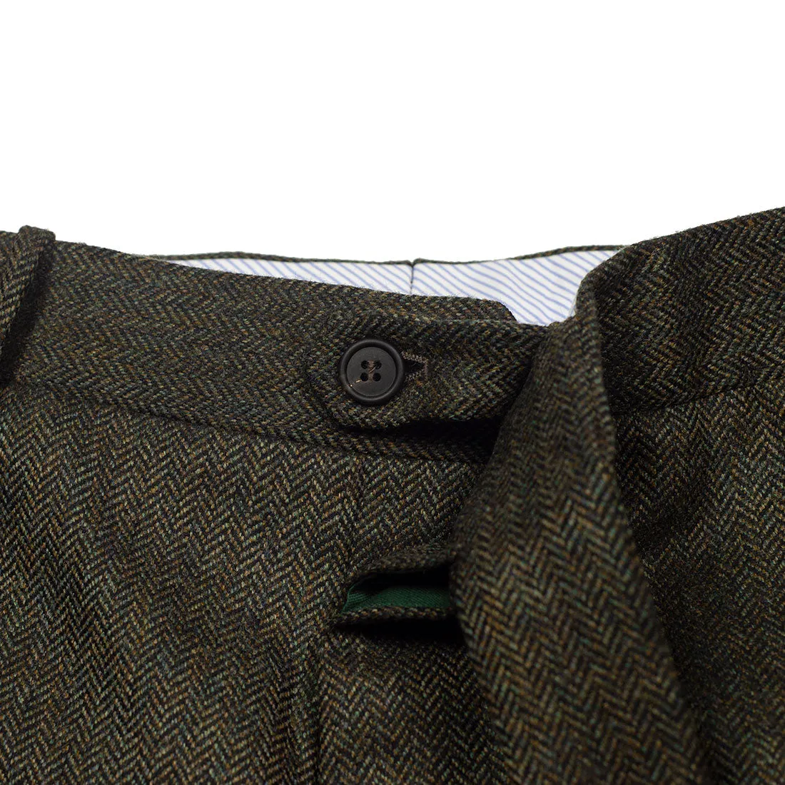 Higher-rise green herringbone flannel wool trousers with side tabs