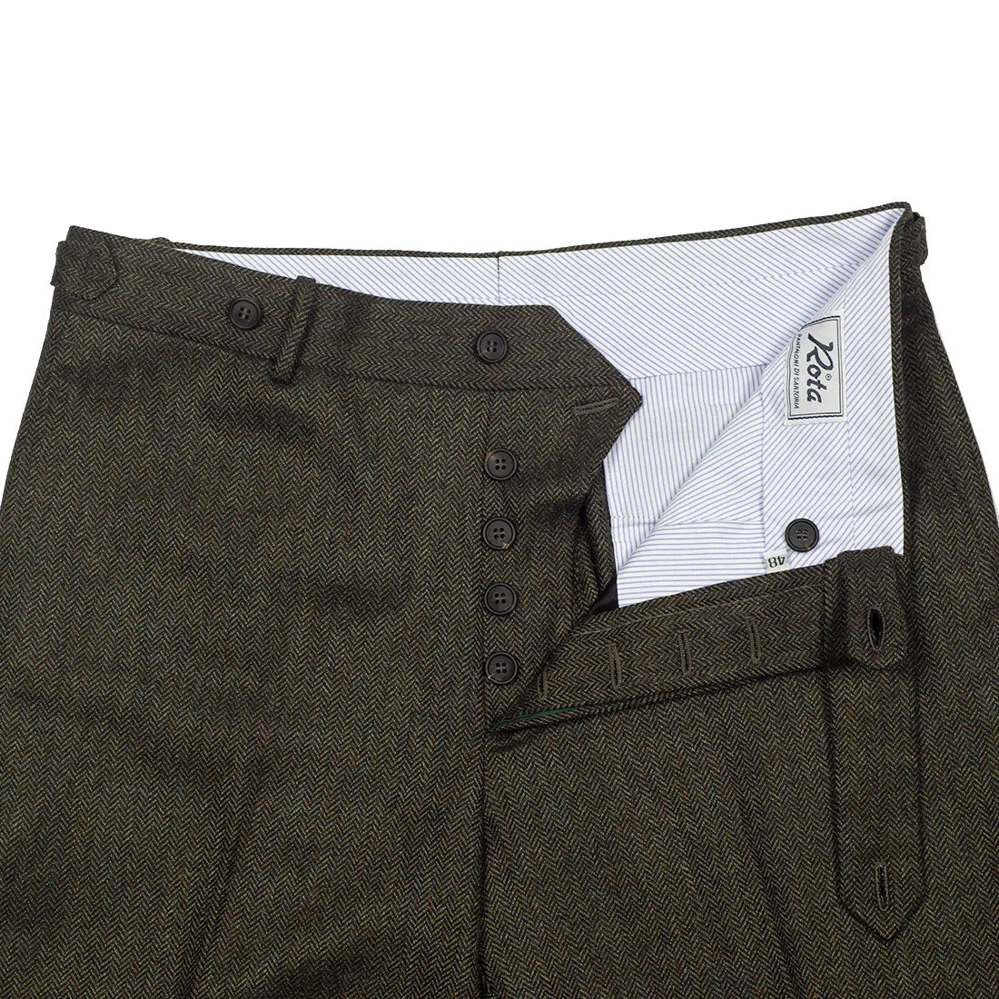 Higher-rise green herringbone flannel wool trousers with side tabs