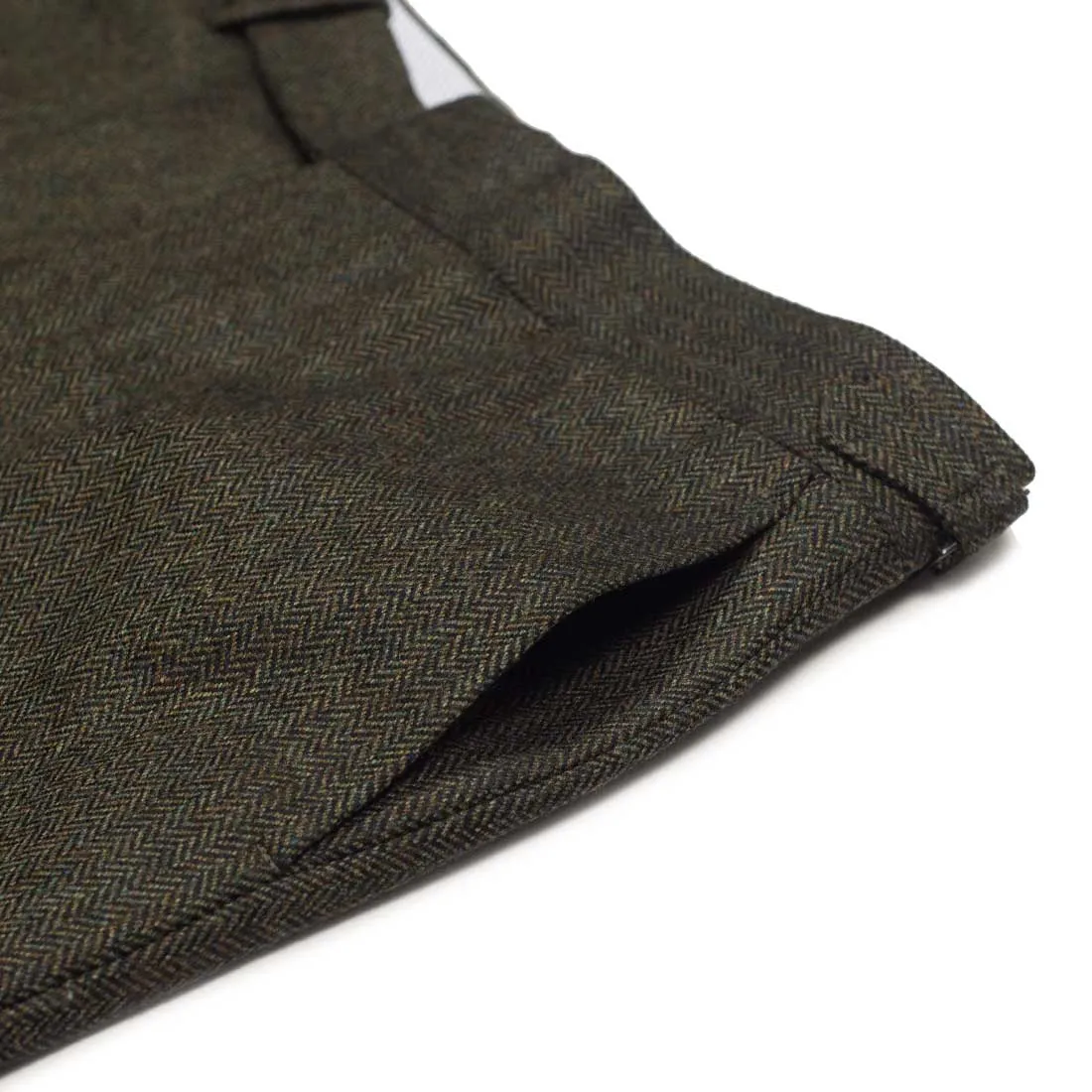 Higher-rise green herringbone flannel wool trousers with side tabs